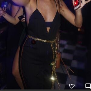 Do+Be black jumpsuit with side stripe.